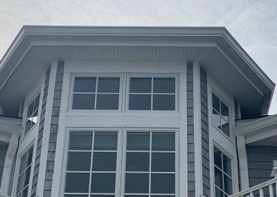 A gray house with large windows