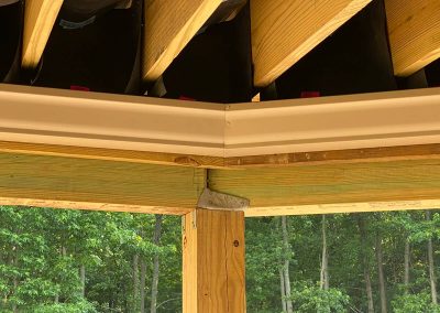 White gutters under wooden beams