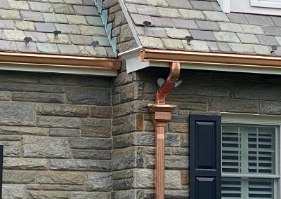 Copper gutters on a stone house