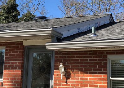 White gutters on a red brick house