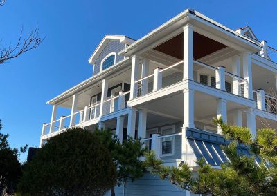 A large building with a white wraparound balcony