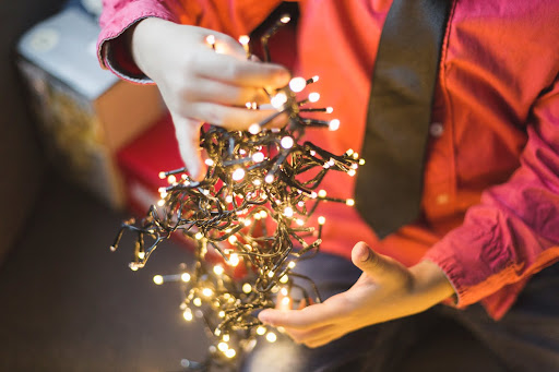 boy sorting through christmas lights how to hang christmas lights from gutters van's rain gutters south jersey